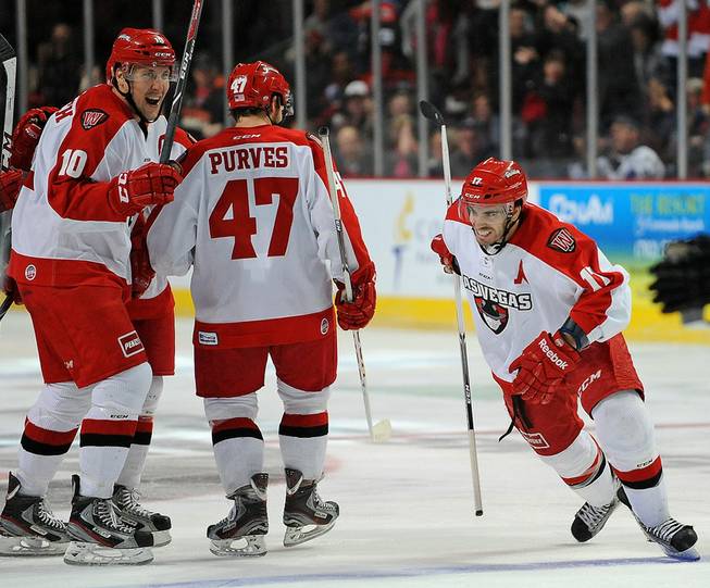 Las Vegas Wranglers forward Adam Huxley (right) celebrates after scoring a second period goal against the Bakersfield Condors at the Orleans Arena on Friday night.