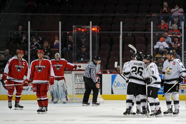 Colorado Eagles players celebrate after scoring a fifth goal against the Las Vegas Wranglers on Tuesday night at the Orleans Arena.