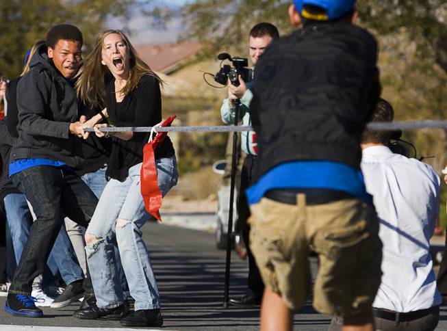 In12Days founder Suzanne Lea joins in a tug-of-war during the 8th day of the 12 days of Christmas at Boys Town Tuesday, December 18, 2011. In12Days is a volunteer-based project aiming to bring the 12 days of Christmas to unsuspecting people in the Las Vegas Valley.