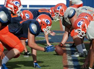 Bishop Gorman Gaels face off against each other on the line during a scrimmage at Fertitta Field on Monday afternoon.