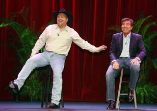 Entertainer Garth Brooks, left, and Wynn Resorts CEO Steve Wynn announce a deal during a news conference in the Encore Theater at the Wynn Las Vegas hotel-casino Thursday, Oct. 15, 2009. The arrangement will bring Brooks out of retirement for a series of special performances in the theater.
