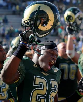Colorado State's Elijah-Blu Smith (22) celebrates with teammates after beating UNLV on Saturday at Hughes Stadium in Fort Collins, Colo.