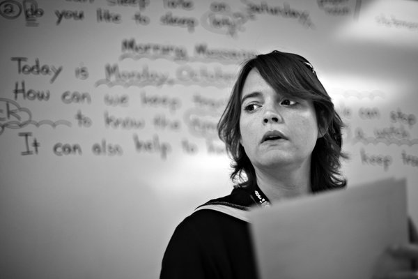 Kathy listens to a student's response in her second-grade class. ...
