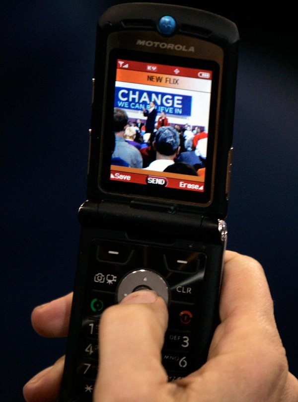 A supporter takes a cell phone photo while Democratic presidential ...