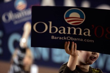 Gavin Sloan, 4, holds a sign while Democratic presidential hopeful Sen. Barack Obama speaks during a town hall meeting at Del Sol High School in Las Vegas Friday, January 11, 2008. 