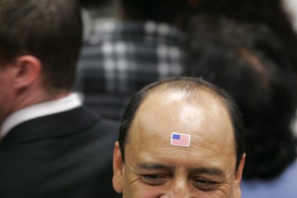 A supporter of presidential candidate Sen. Hillary Clinton wears a flag sticker on his forehead during a rally at the Sheet Metal Workers Union Saturday, Jan. 12, 2008. 