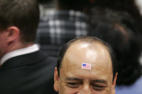 A supporter of presidential candidate Sen. Hillary Clinton wears a ...