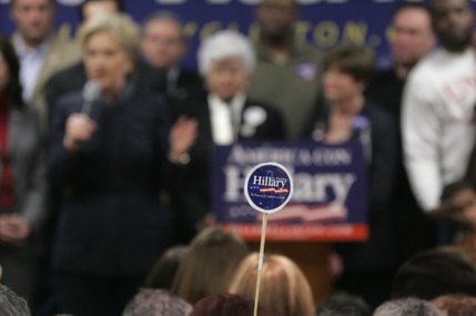 A supporter holds up a sticker as presidential candidate Sen. Hillary Clinton speaks during a rally at the Sheet Metal Workers Union Saturday, Jan. 12, 2008.