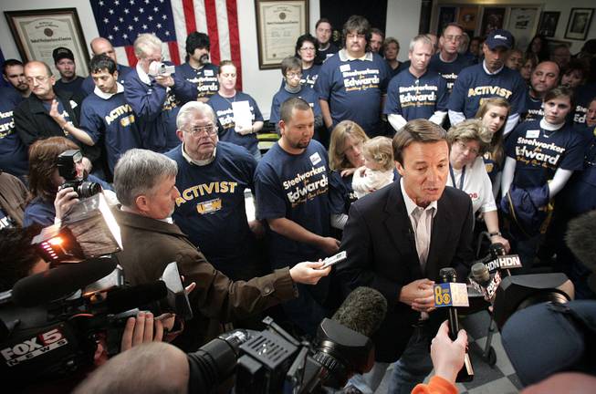 Supporters and journalists surround John Edwards during an appearance Wednesday at the Steelworkers union hall in Henderson. The union has endorsed the former senator from North Carolina.