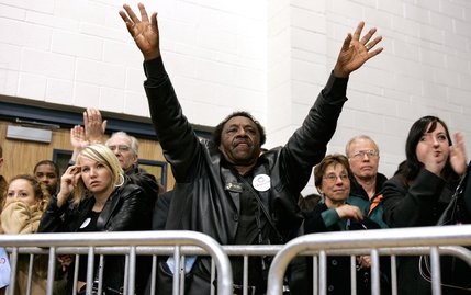 Irving Williams of Las Vegas tries to get the attention of Democratic presidential hopeful Sen. Barack Obama to ask a question about Hurricane Katrina and New Orleans during a town hall meeting at Del Sol High School in Las Vegas Friday, Jan. 11, 2008.