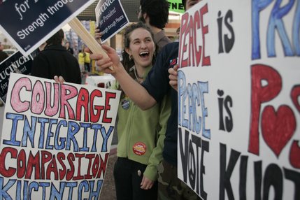 A group of Dennis Kucinich supporters proudly display their candidate's message of 