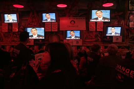 SEIU members and Barack Obama supporters watch their candidate during a debate rally at Paradise Cantina Tuesday, Jan. 15, 2008.