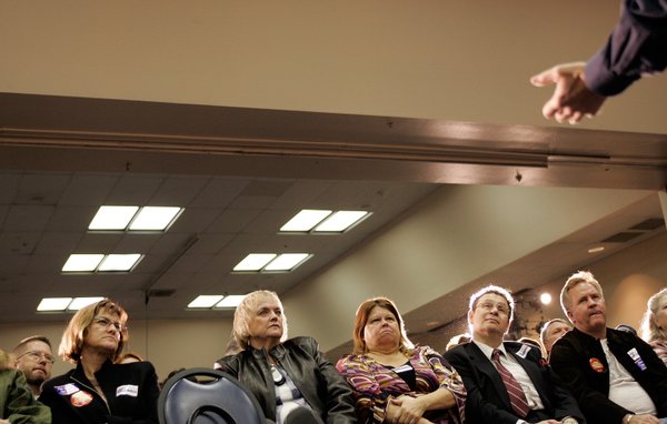 A crowd listens as presidential hopeful John Edwards speaks during ...