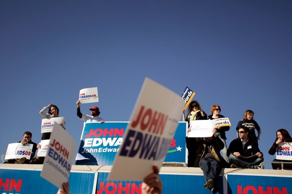 Volunteers for the presidential campaign for John Edwards listen as ...