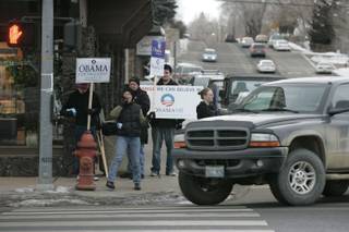 Sen. Barack Obama supporters hold signs up at a busy intersection in Elko Thursday, Jan. 17, 2008.