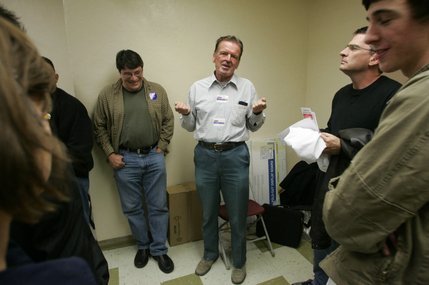 John Edwards supporter Walter Barbuck, center, announces he is joining the Barack Obama group after failing to gather enough people to make Edwards a viable candidate during a Democratic presidential caucus at UNLV.