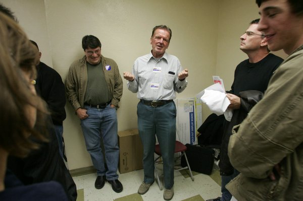 John Edwards supporter Walter Barbuck, center, announces he is joining ...
