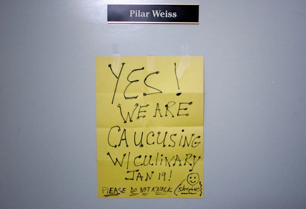 A sign hangs on the outside door of Culinary Union ...