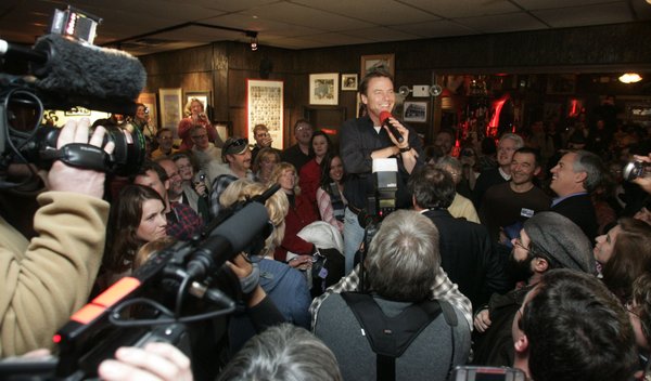 Presidential candidate John Edwards is surrounded by supporters and the ...