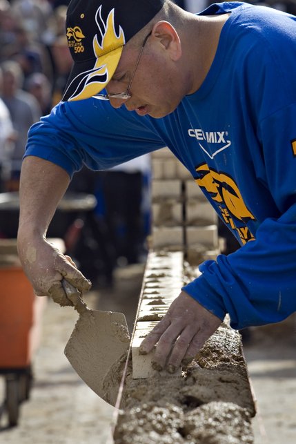 Lupe Marquez, of Garland, Texas, focuses on his wall with ten minutes left on the clock during the Spec Mix Bricklayer Competition at The World of Concrete convention at the Las Vegas Convention Center on Thursday, January 23, 2008.