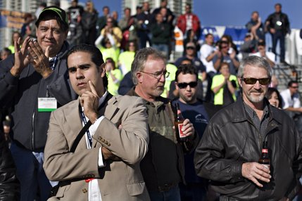 A mixed group of spectators packed the bleachers in a parking lot near the Las Vegas Strip for the Spec Mix Bricklayer Competition at The World of Concrete convention at the Las Vegas Convention Center on Thursday, January 23, 2008. 