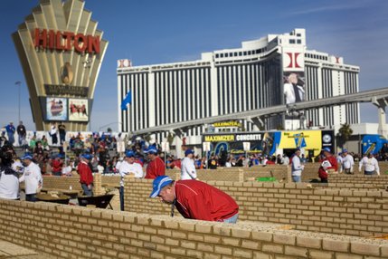 Bricklaying instructor, Don Walker, of Addison, Illinois, judges competitors walls during the Spec Mix Bricklayer Competition at The World of Concrete convention at the Las Vegas Convention Center on Thursday, January 23, 2008.