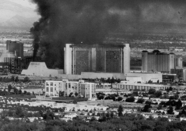 Smoke billows out of the MGM Grand as the hotel ...