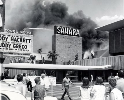 Guests hang back as fire fighters work to put out the blaze at the Sahara hotel in 1964. The cause of the fire is unknown, as are the amount of injuries sustained from the fire. This fire is a precursor to the devistating MGM Grand fire in 1980.
