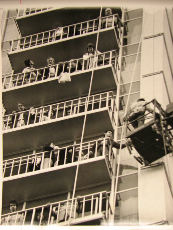 MGM guests stand on the balconies of their rooms as ...