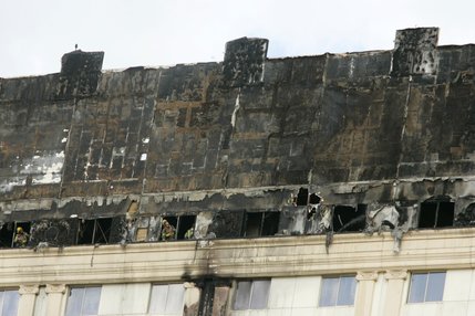 Firemen look out the top floor of the Monte Carlo after a fire broke out Friday, Jan. 25, 2008. 