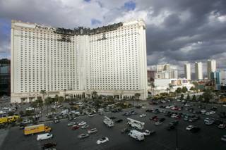 The charred upper floors of the Monte Carlo show where a fire broke out Friday, Jan. 25, 2008.
