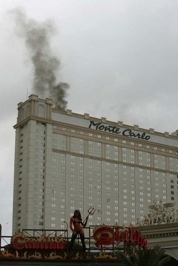 Smoke rises from the Monte Carlo hotel and casino during ...