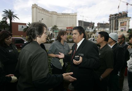 Monte Carlo housekeeping supervisor Roberto Vargas, center, sends workers home after a roof fire at the casino Friday, January 25, 2008.