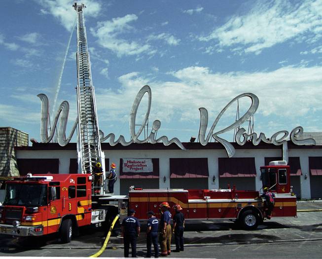 Firefighters finish putting out the blaze at the Moulin Rouge Hotel on May 2, 2003. The hotel is the first fully inegrated hotel in Las Vegas and is only open for five months. The fire starter, a former employee, is sentenced to over four years in jail for the crime.