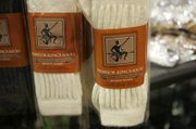 One alpaca produces about $300 in wool each year, some of which is used to make socks like these..