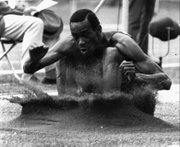 Bob Beamon shatters the world long-jump record in the 1968 Olympics in Mexico City.