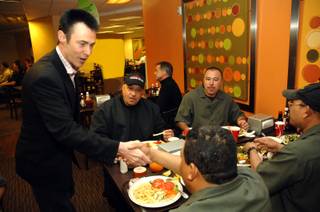 Master magician Lance Burton greets Monte Carlo employees Jose Ruiyes, Gelder Garcia, Tommy Hanesana, Jorge Munoz and Fidel Ayala during their lunch break. Employees are hard at work making repairs after an exterior fire forced the property to temporarily close last Friday.