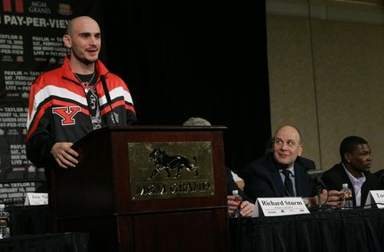 WBC middleweight champion Kelly Pavlik, left, of Ohio, speaks during a news conference at the MGM Grand Wednesday February 13, 2008. Pavlik will face Jermain Taylor, far right, of Arkansas in a 12-round non-title rematch in the MGM Grand Garden Arena Saturday. Pavlik took the title from Taylor in a fight last year. Boxing promoter Lou DiBella listens at center.