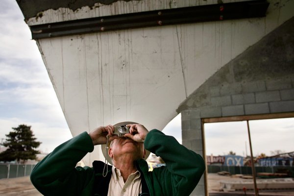 Mel Green takes photos during a survey of the old ...
