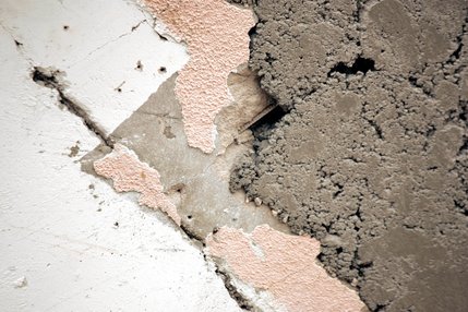 Concrete patches and pieces of old stucco on parts of the La Concha structure.