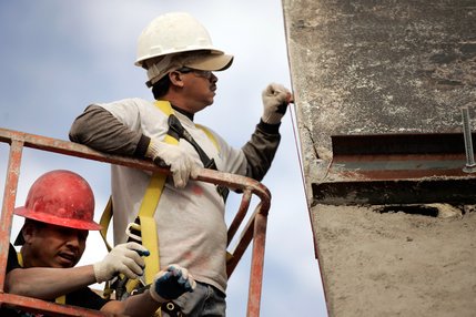  Alvaro Zepada, left, and Sergio Garcia of Dean Concrete work on the restoration of the old La Concha Motel lobby.
