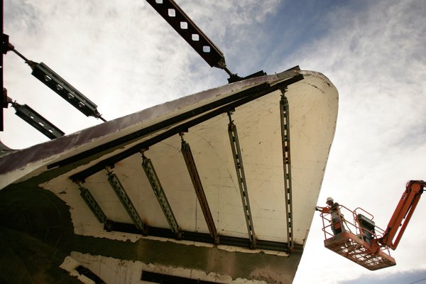 Workers from Dean Concrete work on the structure of the ...