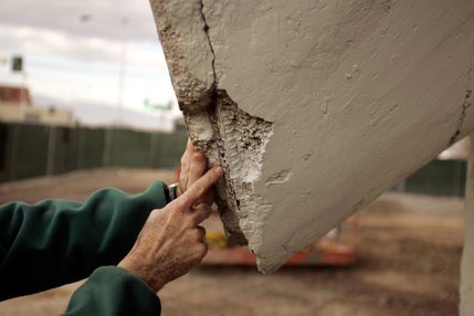 Engineer Mel Green points out areas for restoration in the old La Concha Motel lobby structure.