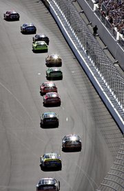 Racers begin last year’s UAW-DiamlerChrysler 400 at the Las Vegas Motor Speedway. The drivers return this week.