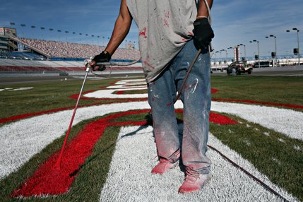 James France finishes trim work on the infield logos at the Las Vegas Motor Speedway. 