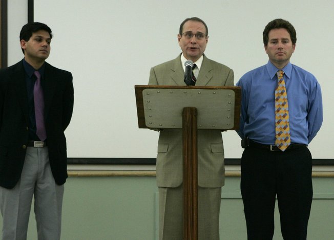 Endoscopy Center of Southern Nevada doctors Sanjay Nayyar, left, and Clifford Carrol flank fellow doctor Eladio Carrera as he reads a statement  during a news conference at the health district Wednesday, February 27, 2008. The Southern Nevada Health District is notifying about 40,000 former patients of the Endoscopy Center of Southern Nevada that they may have been exposed to hepatitis C.