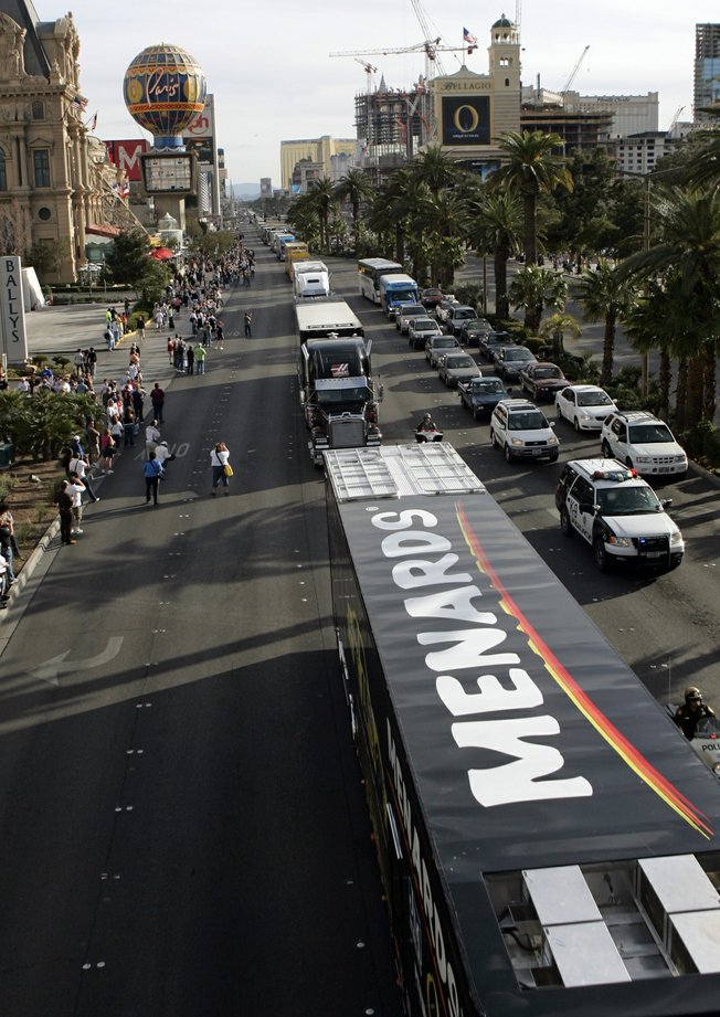 NASCAR car haulers, the 18-wheelers that transport the race cars and teams to each track, pass under the pedestrian overpass at Flamingo Road as they parade northbound on Las Vegas Boulevard Thursday, February 28, 2008. About 50 haulers, with police escort, paraded from the Welcome to Las Vegas sign to Sahara Avenue. The NASCAR Sprint Cup UAW-Dodge 400 is Sunday at the Las Vegas Motor Speedway and is expected to attract about 145,000 fans.