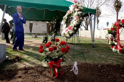 Zyber Selimaj takes one last look at the newly covered grave for his wife Deshira Selimaj after her burial at the Bunker's Eden Vale Cemetery in Las Vegas Thursday, Feburary 28, 2008.