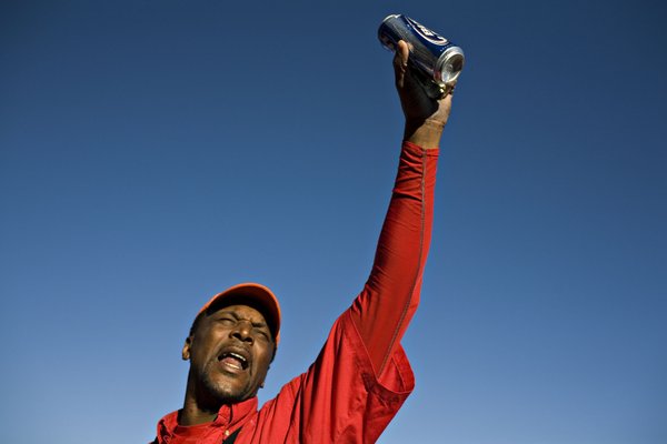 Albert Towns, of Atlanta, Ga., yells last call for beer ...