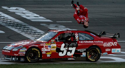 Carl Edwards celebrates with a trademark flip off his race car after winning the NASCAR UAW-Dodge 400 at Las Vegas Motor Speedway.